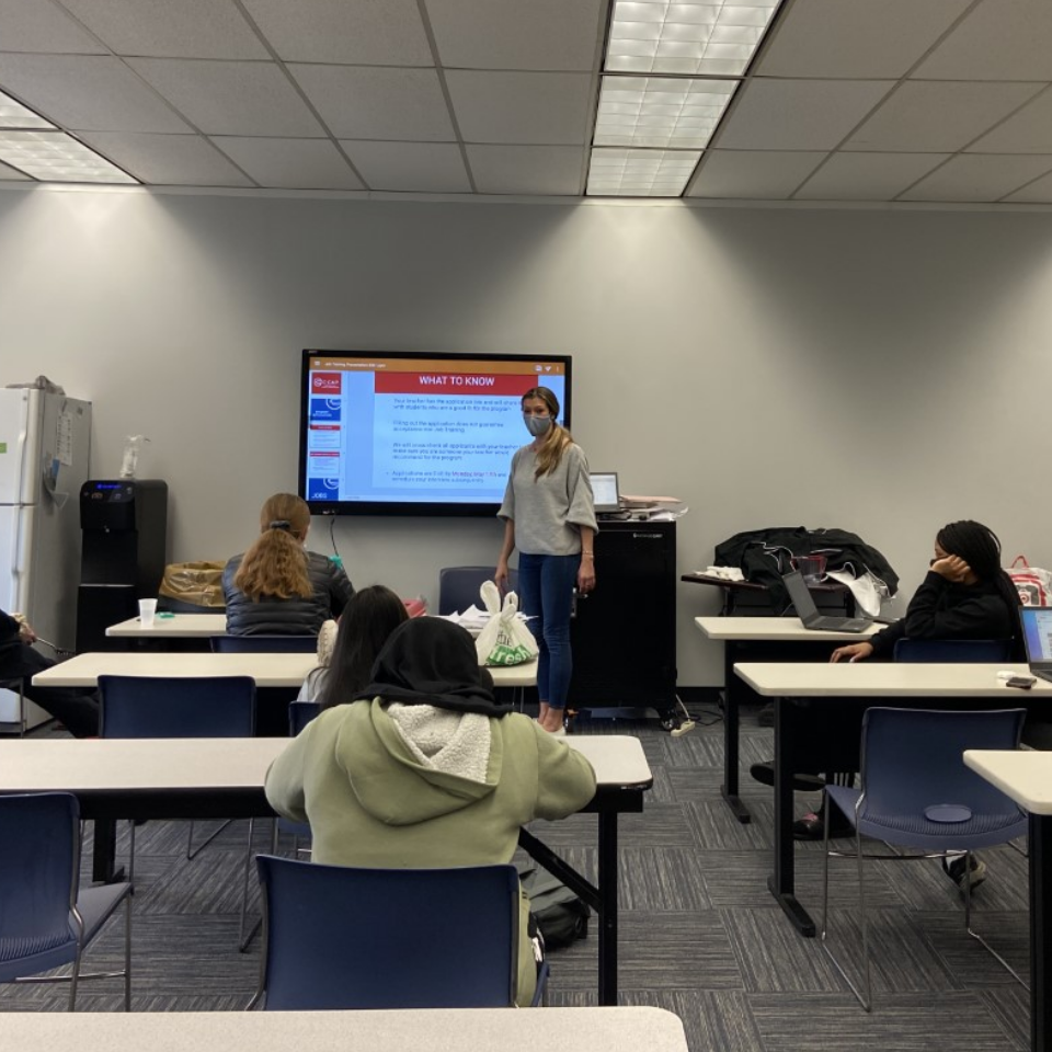 Students in a Classroom Looking at a Presentation