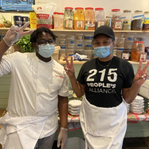 Two People making Peace Signs with Masks