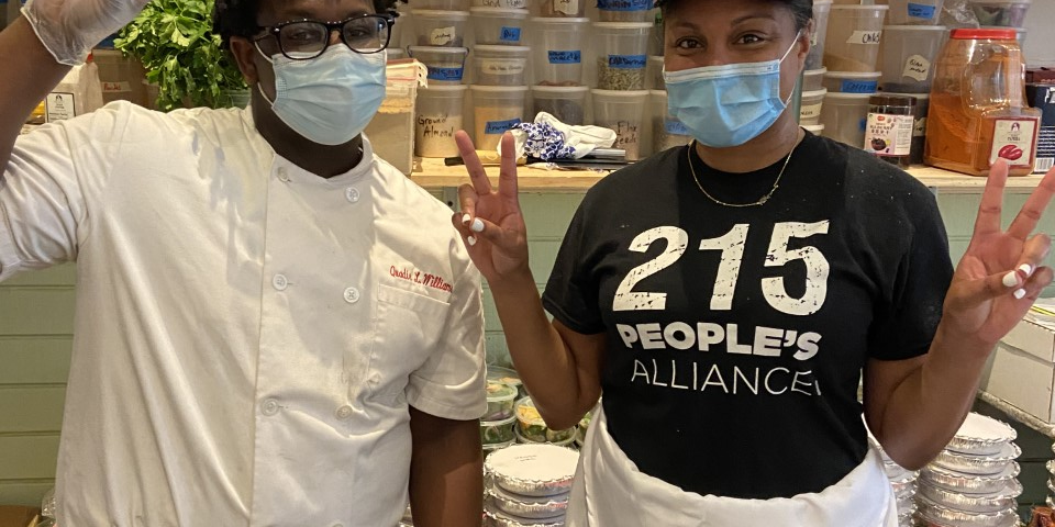 Two People making Peace Signs with Masks