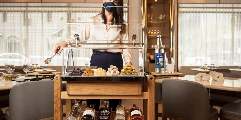 Amy Racine, the beverage director at Iris, manages a sweets and libations cart at the restaurant. Credit: Karsten Moran for The New York Times
